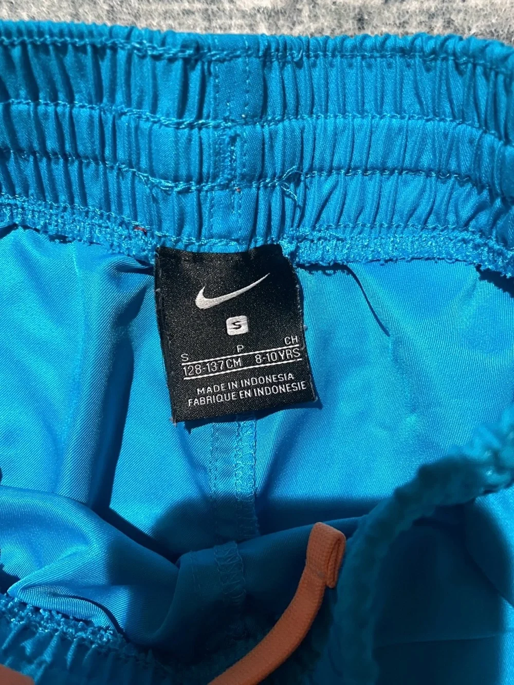 Nike Kids blue swim trunks size small